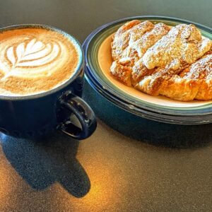 Steaming Cappuccino and Warm Almond Croissant